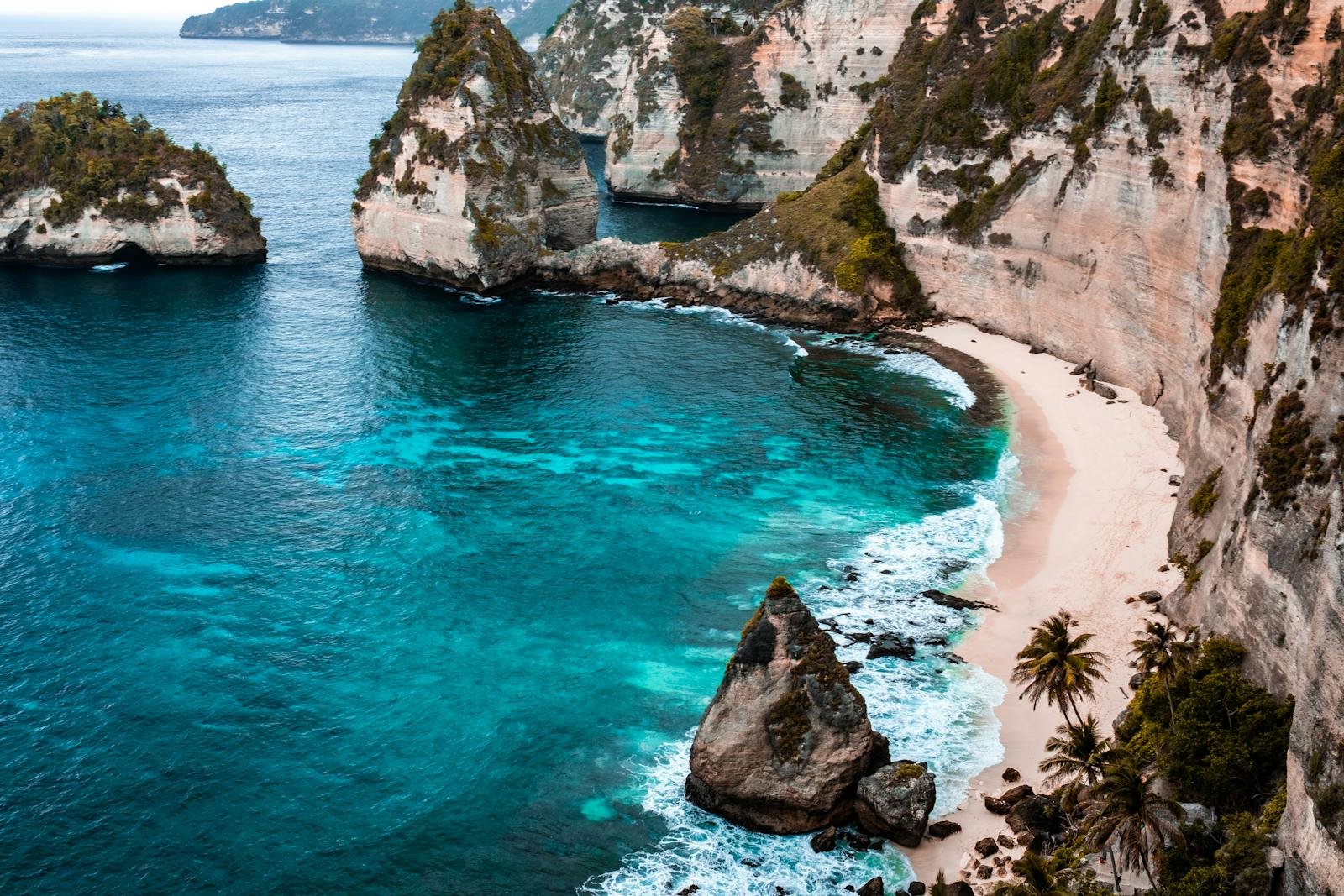 A breathtaking view of Nusa Penida's turquoise waters and rocky cliffs in Bali, Indonesia.